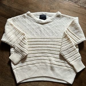 Cream color crew neck sweater, it has patterns, brand is Q